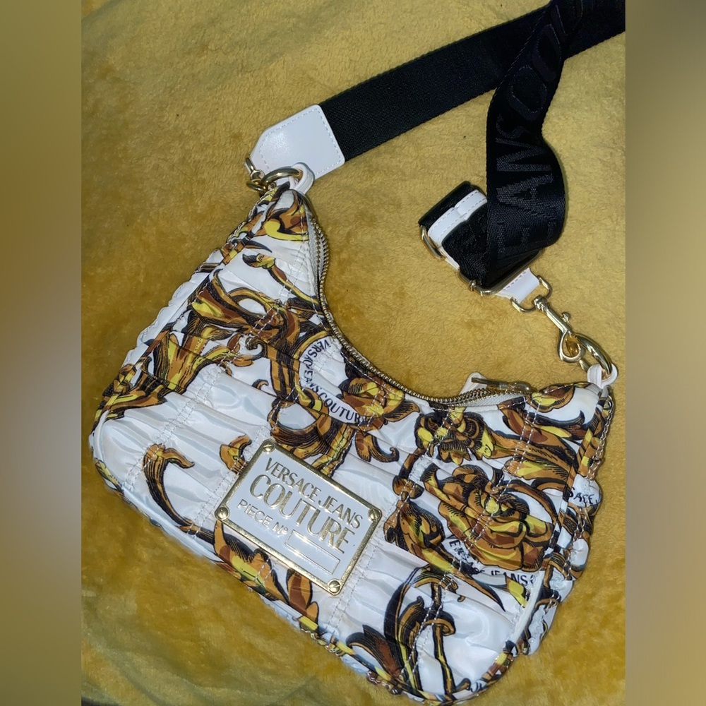 Versace purse. Brand new. Paid $300 and asking for $100